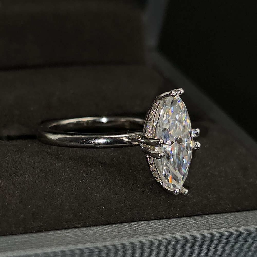 4CWT Moissanite 8-prong marquise cut set in solid S925 sterling silver.